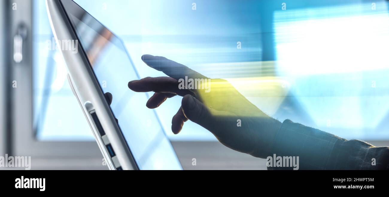 Hand of engineer using tablet PC at home office Stock Photo