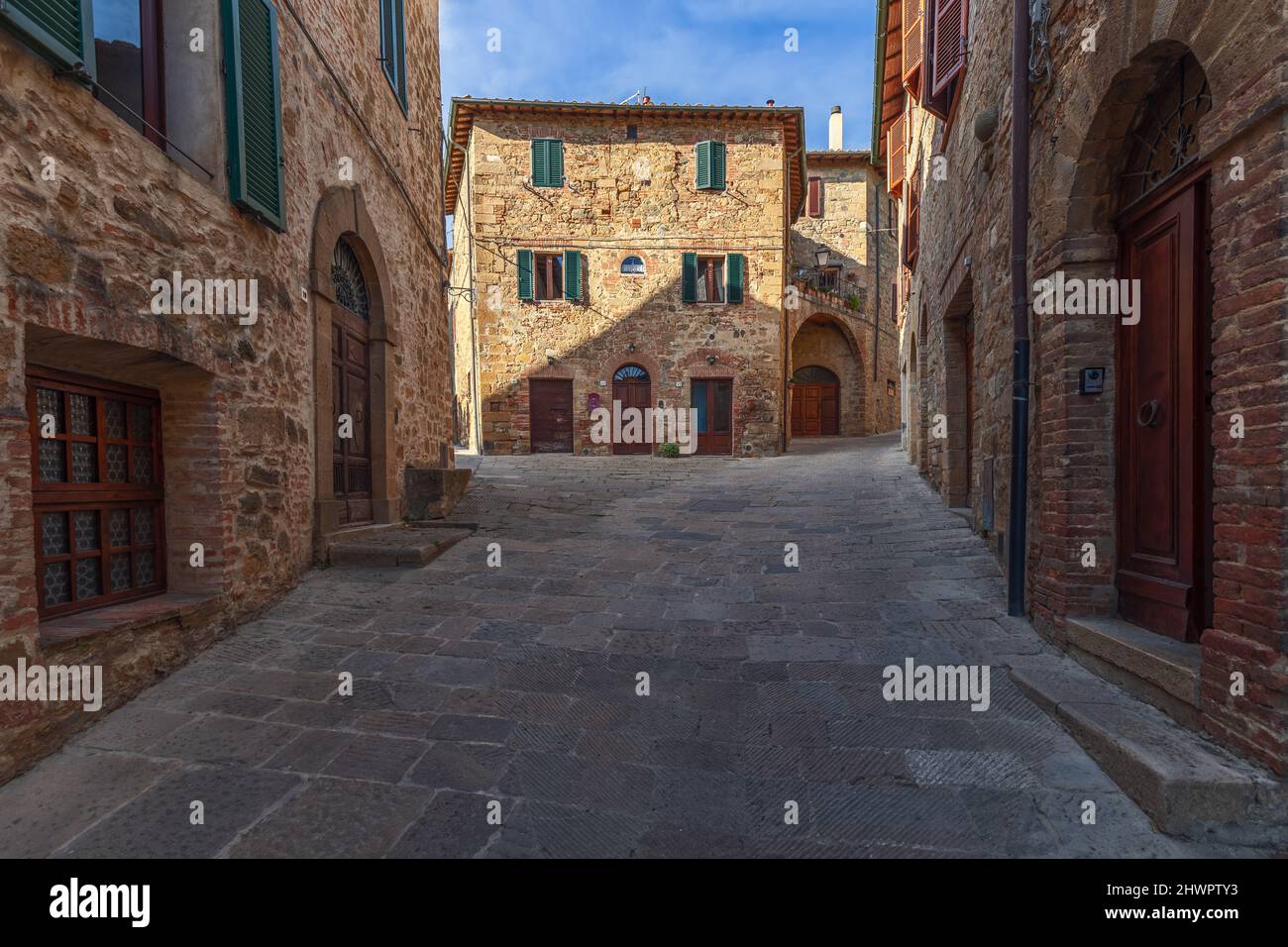 Montecchio Large brick stone walls of the medieval buildings of Monticchiello city ...