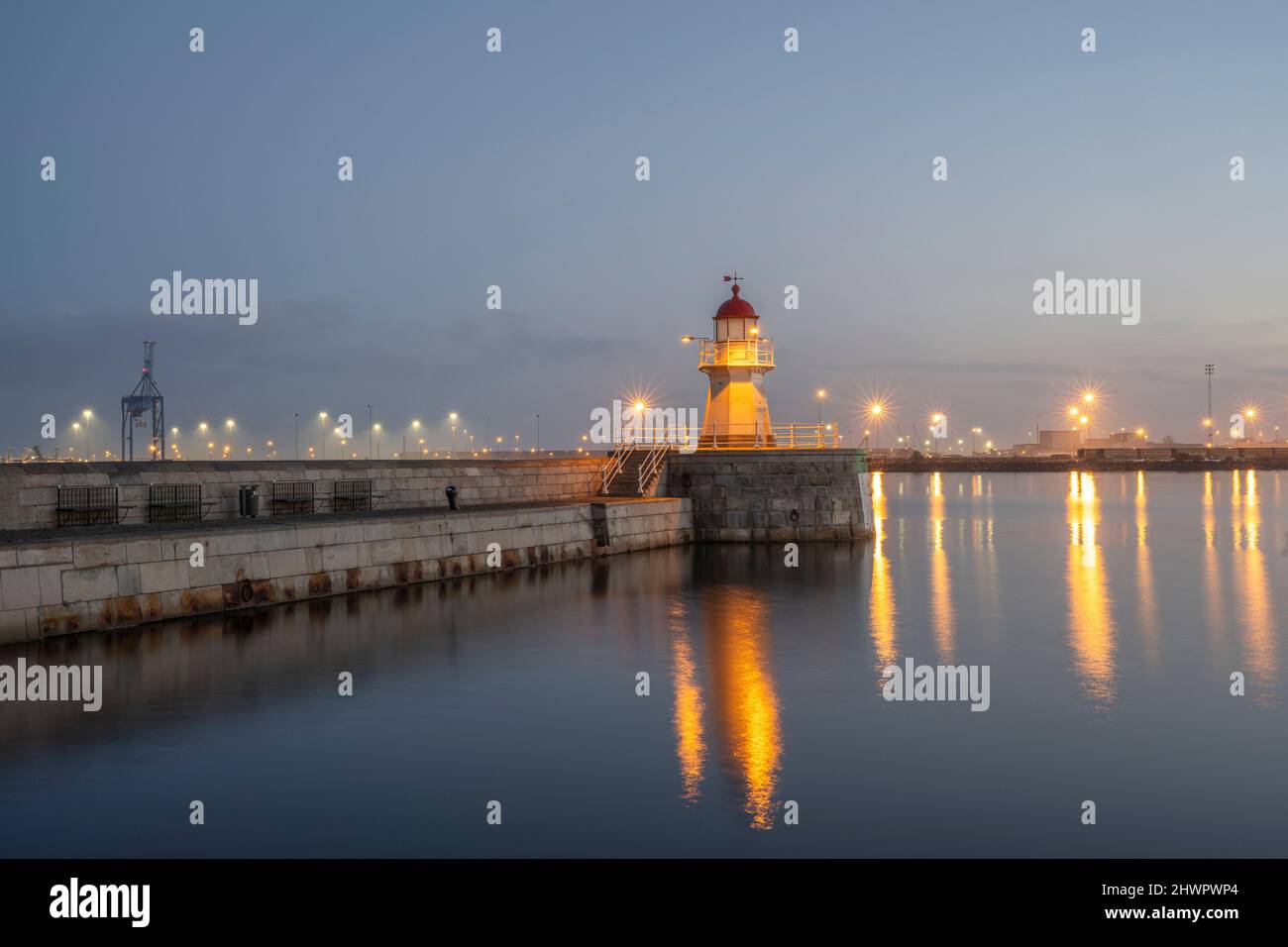 Sweden, Skane County, Malmo, harbor lighthouse at dawn Stock Photo
