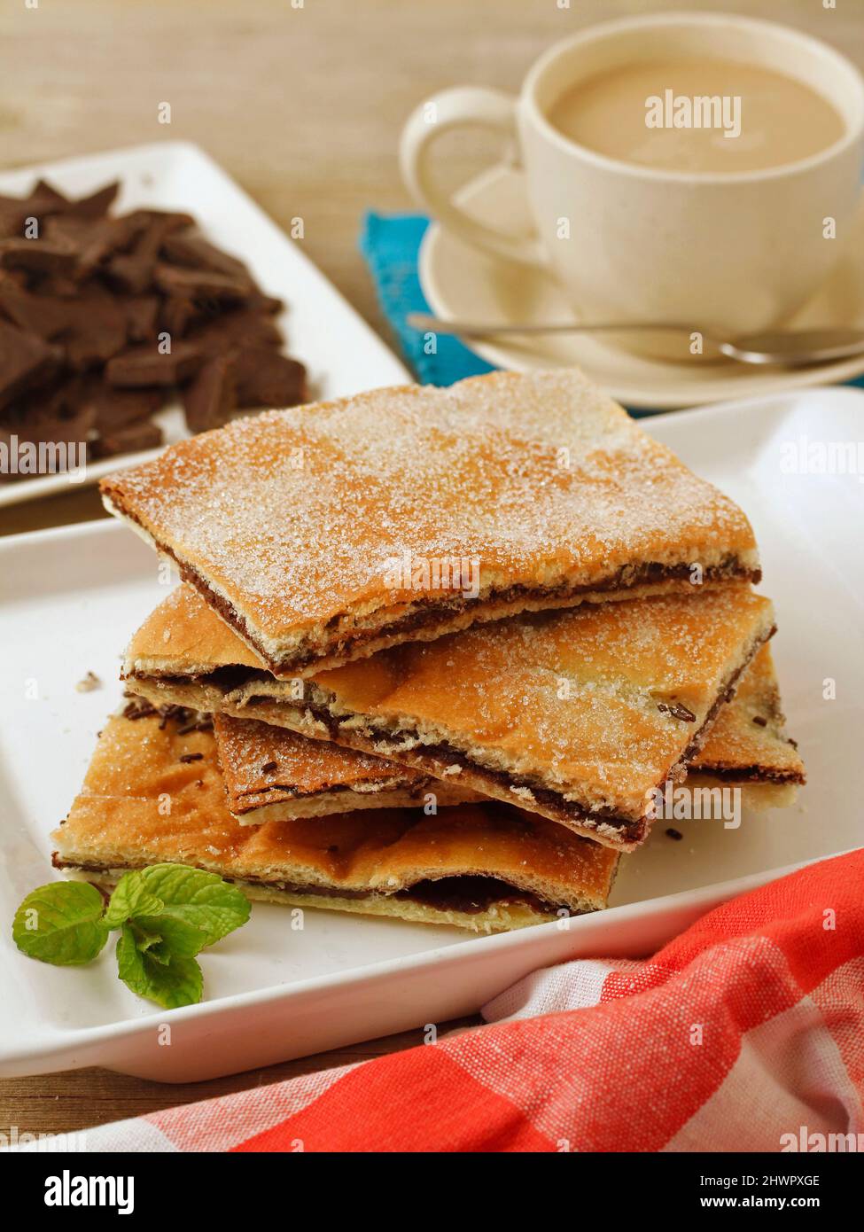 Coca filled with chocolate. Typical food from Catalonia, Spain. Stock Photo