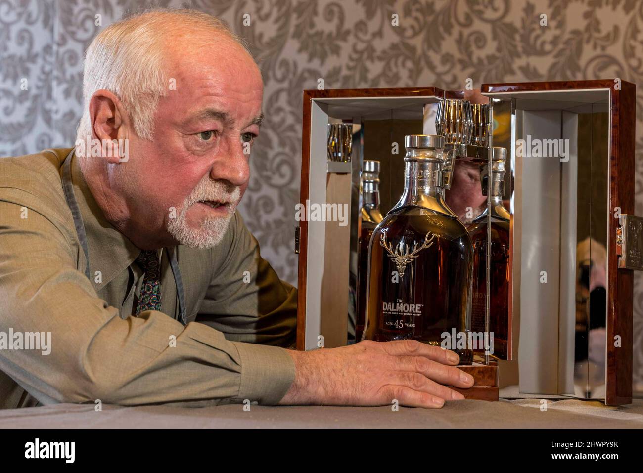 Edinburgh, United Kingdom. 07 March, 2022 Pictured: L to R Bonhams Danny Mcilwraith with a Dalmore 45-year old bottled in a Baccarat crystal decanter estimated to make £7, 000-8, 000. A bottle of one of the oldest known Macallan Scotch Whisky ever produced – The Macallan-78 year old – leads the auction for Bonhams Whisky sale in Edinburgh with an estimate of £65,000 - £70,000. Credit: Rich Dyson/Alamy Live News Stock Photo