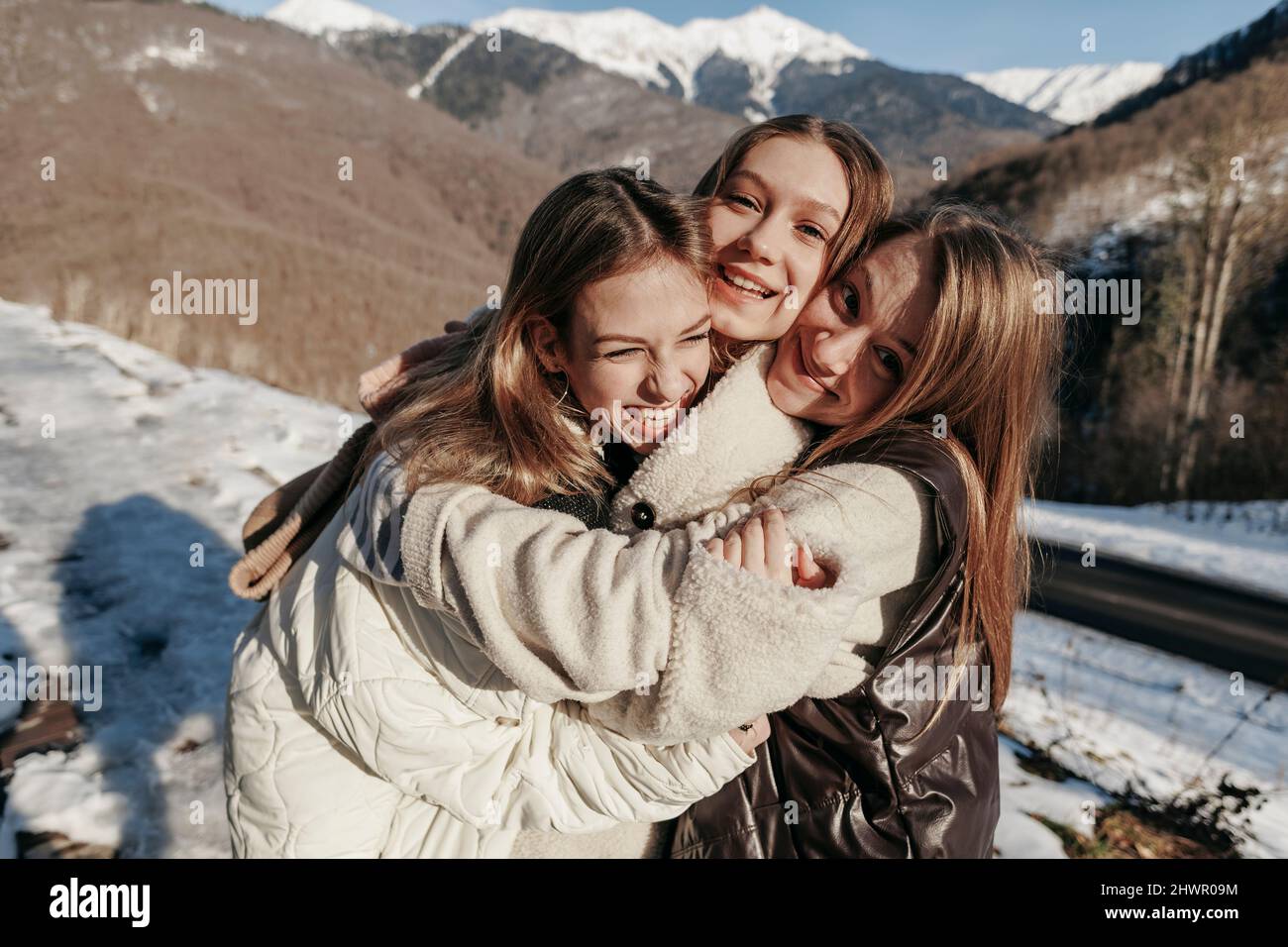Happy girls hugging other hi-res stock photography and images - Alamy