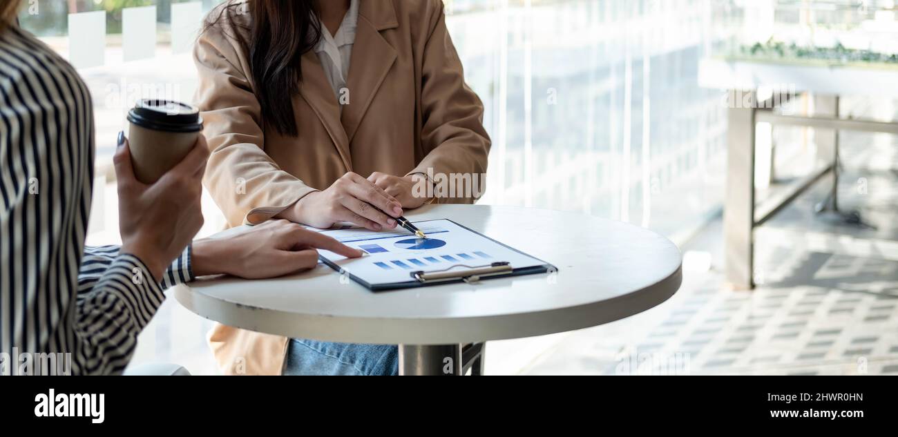 Close up business people meeting in office. hands hold documents with financial statistic discussion analysis report data the charts graphs Finance Stock Photo