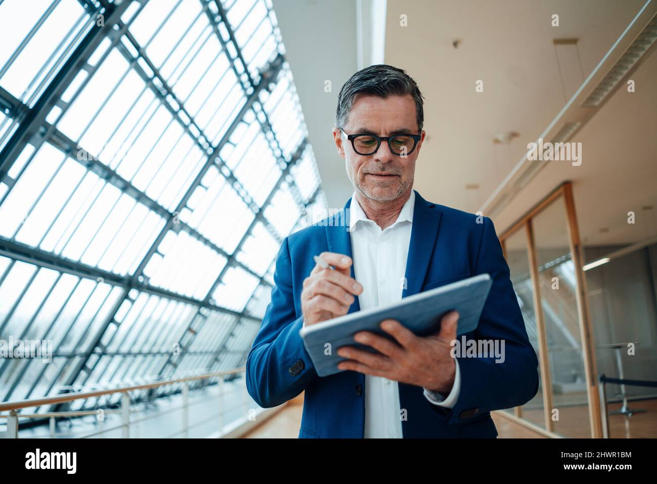 Engineer working on tablet PC at office Stock Photo