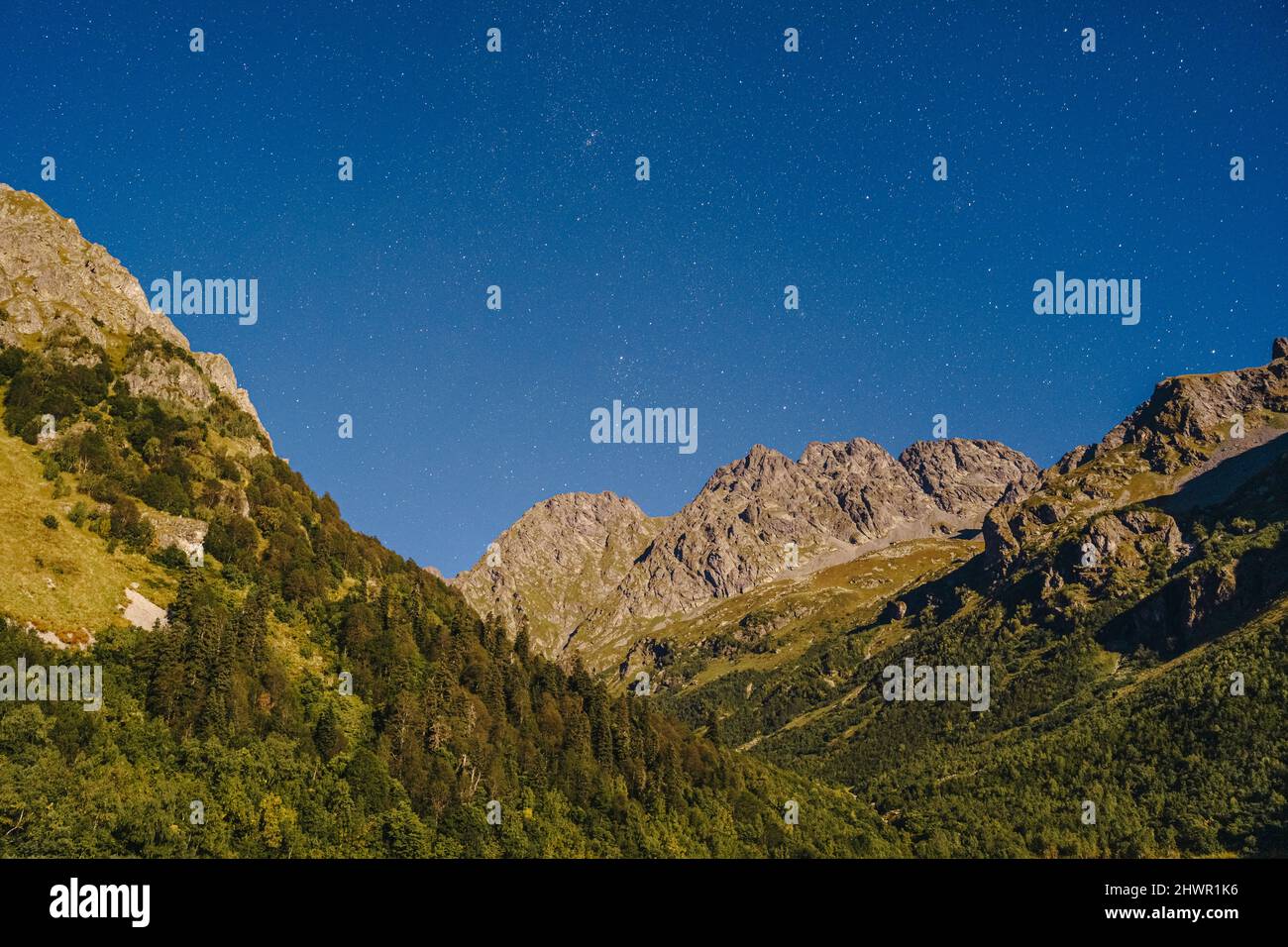 Caucasus mountain range with star field at night, Sochi, Russia Stock Photo