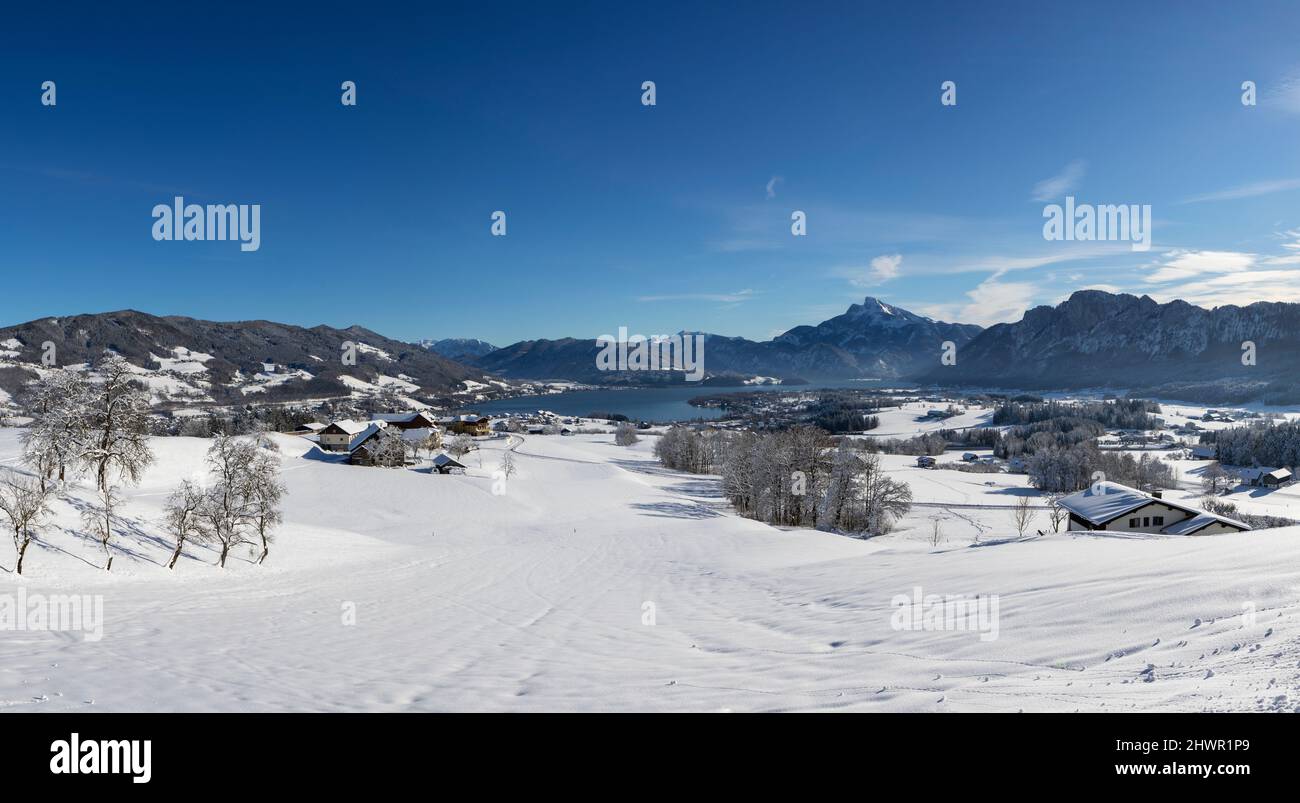 Austria, Upper Austria, Mondsee, Snowy landscape of Salzkammergut with Schafberg and Drachenwand mountains in background Stock Photo