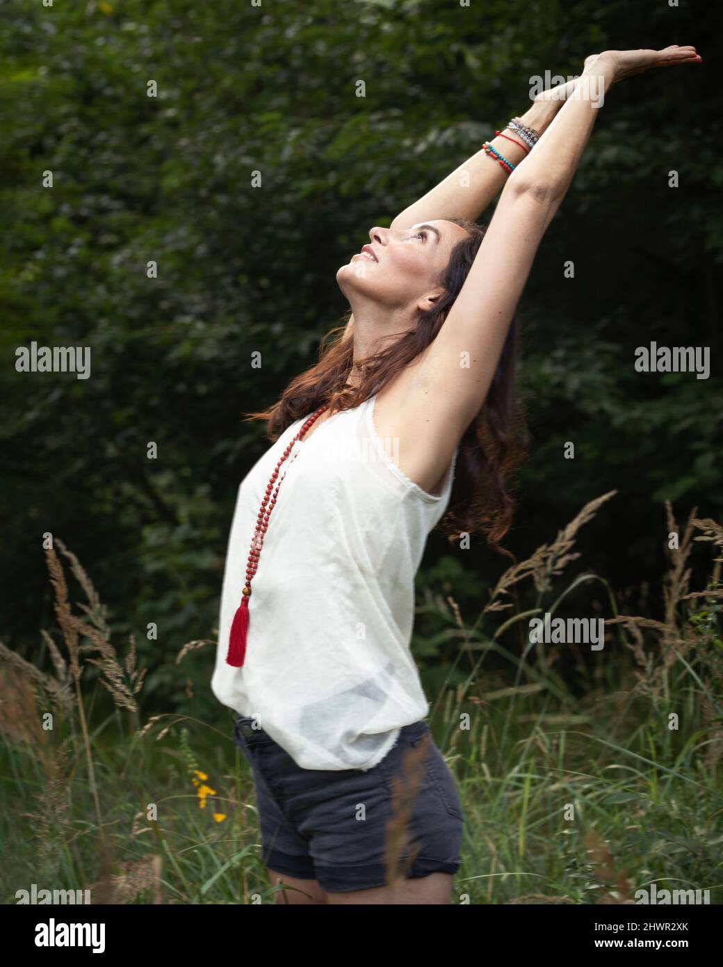 Beautiful woman stretching arms hi-res stock photography and images - Alamy