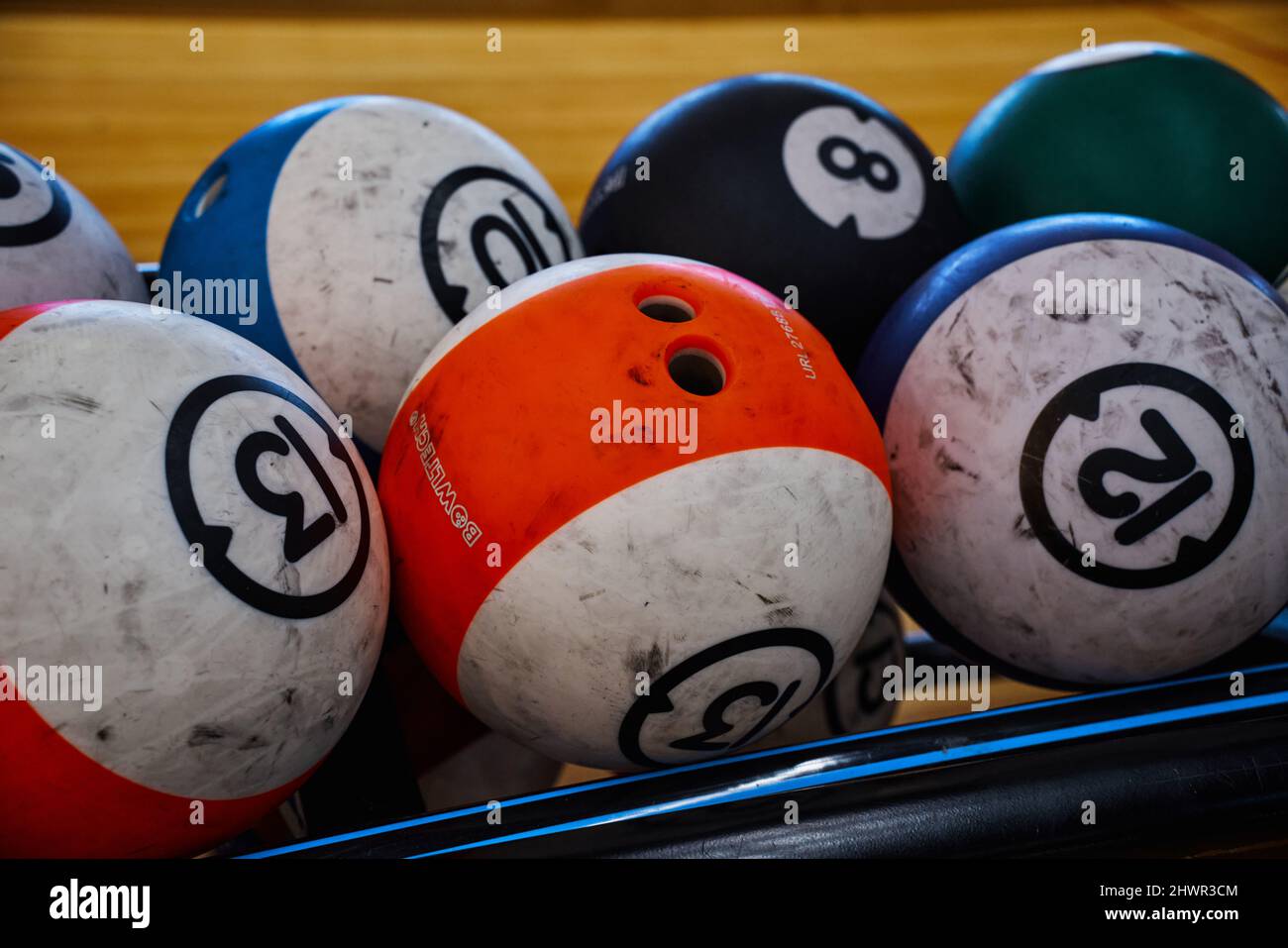 Used balls of various colors to play a bowling game Stock Photo Alamy