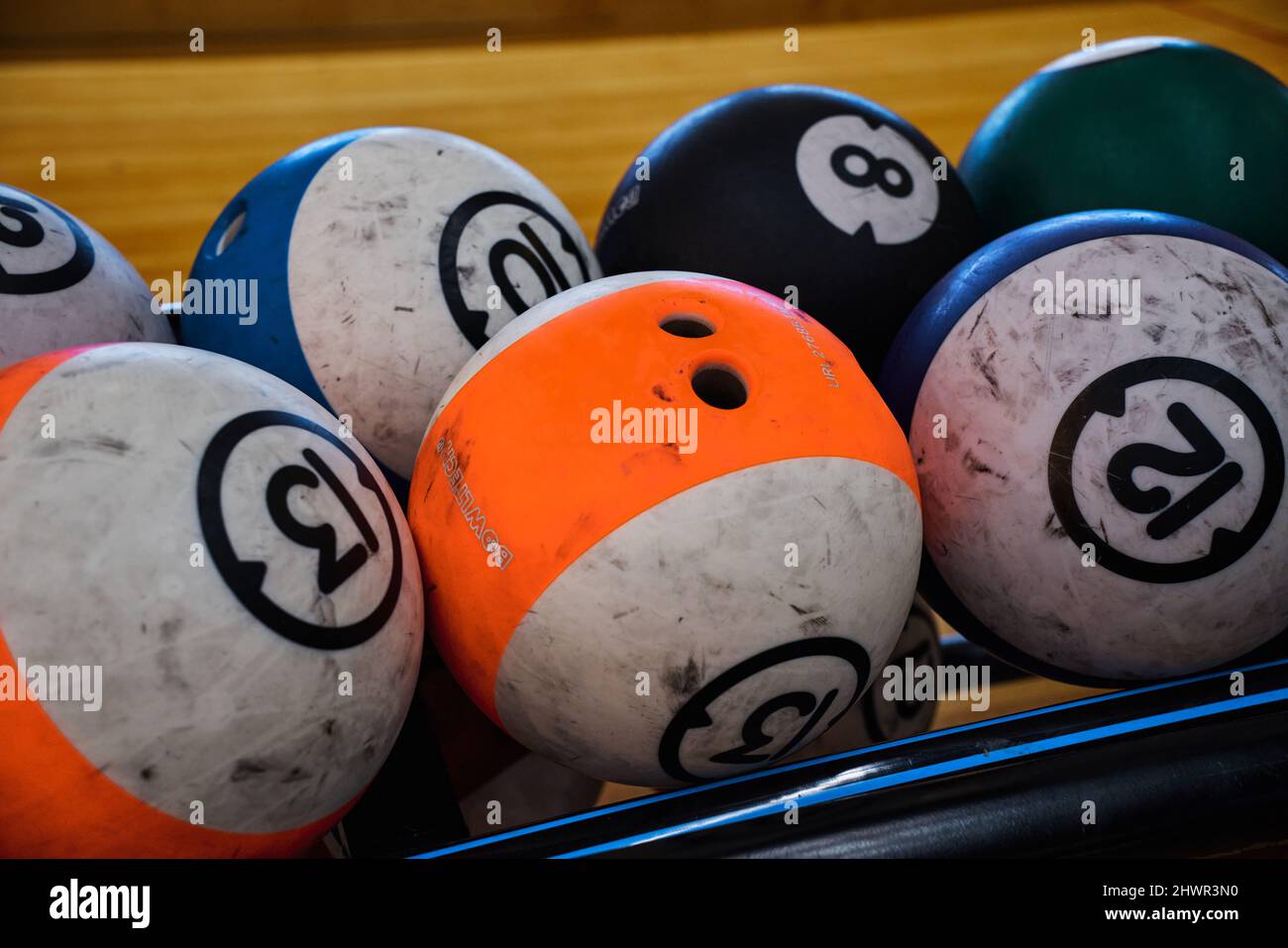 Used balls of various colors to play a bowling game Stock Photo Alamy