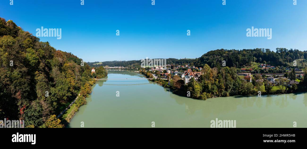 Austria, Upper Austria, Wernstein am Inn, Panoramic view of river Inn in summer with Mariensteg bridge in background Stock Photo
