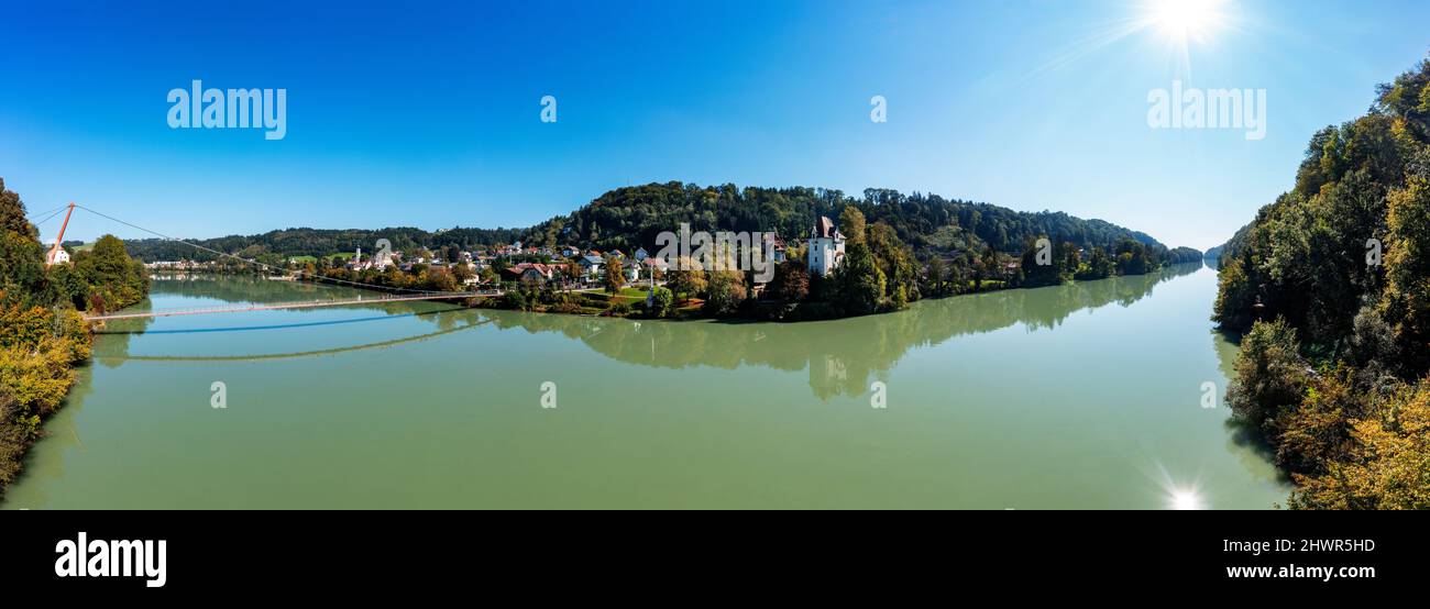 Austria, Upper Austria, Wernstein am Inn, Panoramic view of river Inn in summer with Mariensteg bridge in background Stock Photo