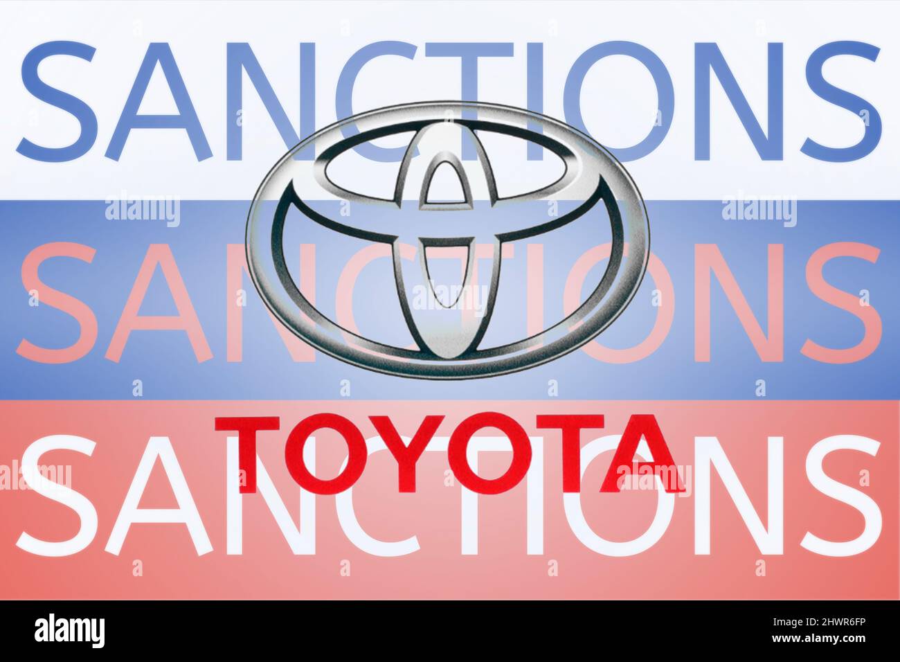 Toyota logo in front of the sanction text on the Russian flag. Fresh sanctions against Russia over its invasion of Ukraine. March 2022, San Francisco, USA Stock Photo