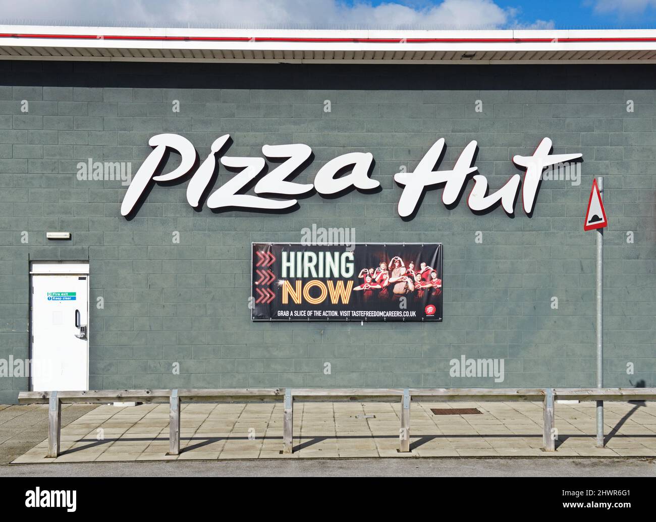 Sign - hiring now - to work at Pizza Hut restaurant, England UK Stock Photo