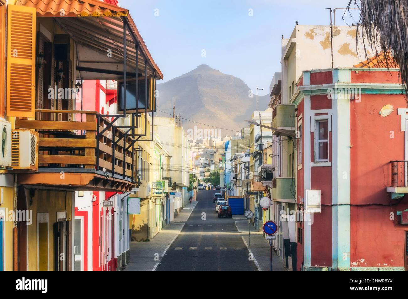 Cape Verde, Sao Vicente, Mindelo, Empty city street with house balcony in foreground and mountain in background Stock Photo