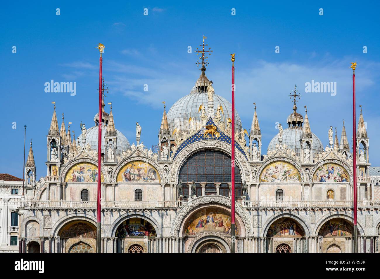 Italy, Veneto, Venice, Flagpoles against facade of Saint Marks Basilica Stock Photo