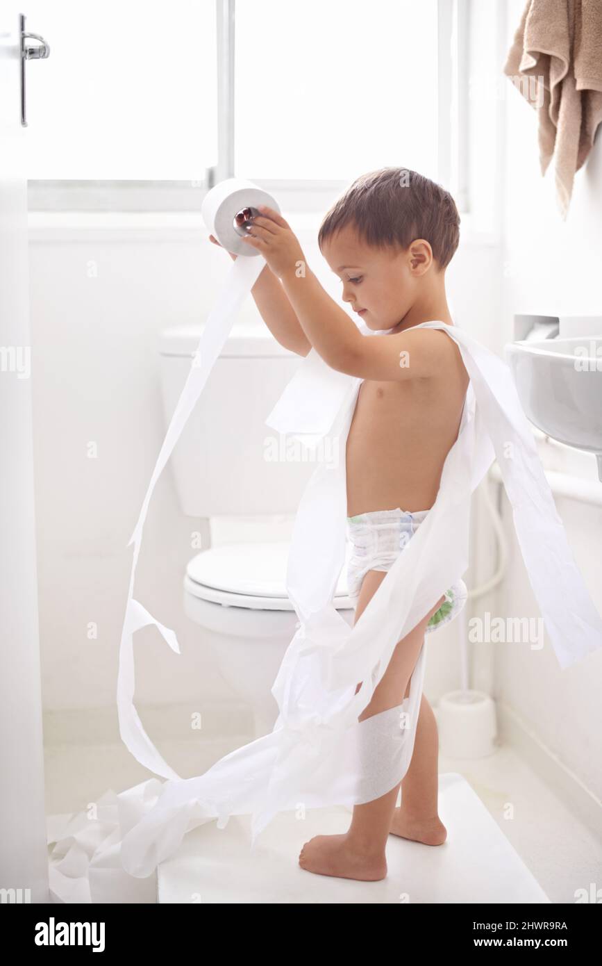 Potty training can be a challenge.... Shot of a young boy in the toilet. Stock Photo