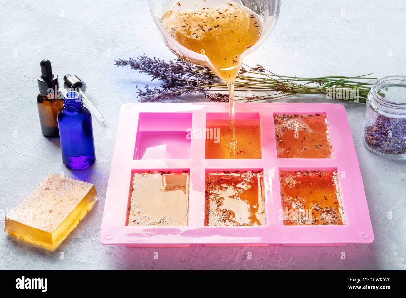Making soap from pour and melt soap base concept. Soap making ingredients  on brown wooden background. melt and pour method, buy a soap base Stock  Photo - Alamy