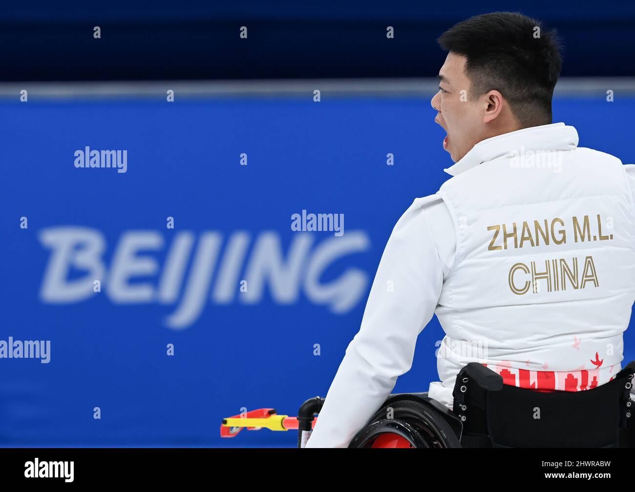 Beijing, China. 7th Mar, 2022. Zhang Mingliang of China cheers up ...