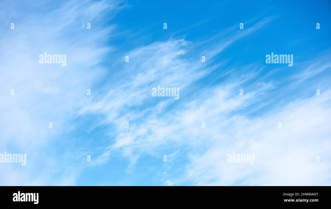 Blue sky with clouds in windy weather -  background with copy space Stock Photo