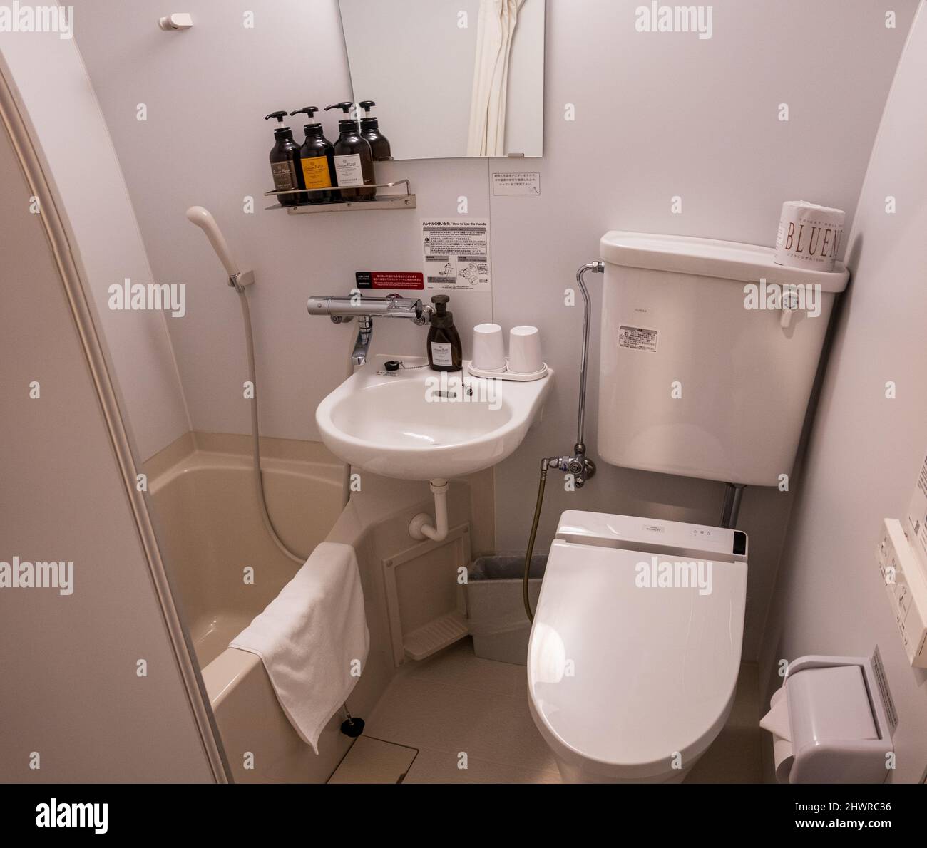 Tiny modern Japanese bathroom and high tech toilet Stock Photo