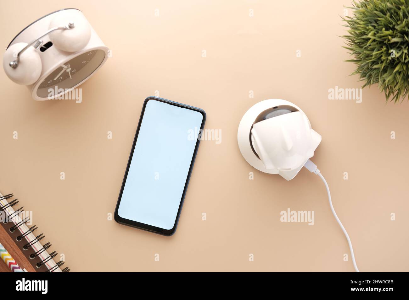 smart phone and CCTV security camera on table  Stock Photo