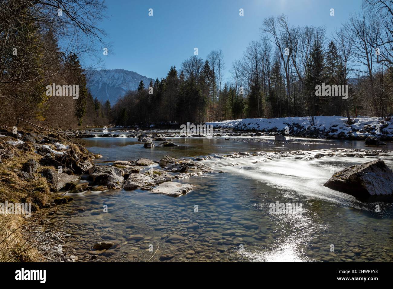 Sunny morning at Weisse Traun river in Ruhpolding, Bavaria, Germany in winter Stock Photo