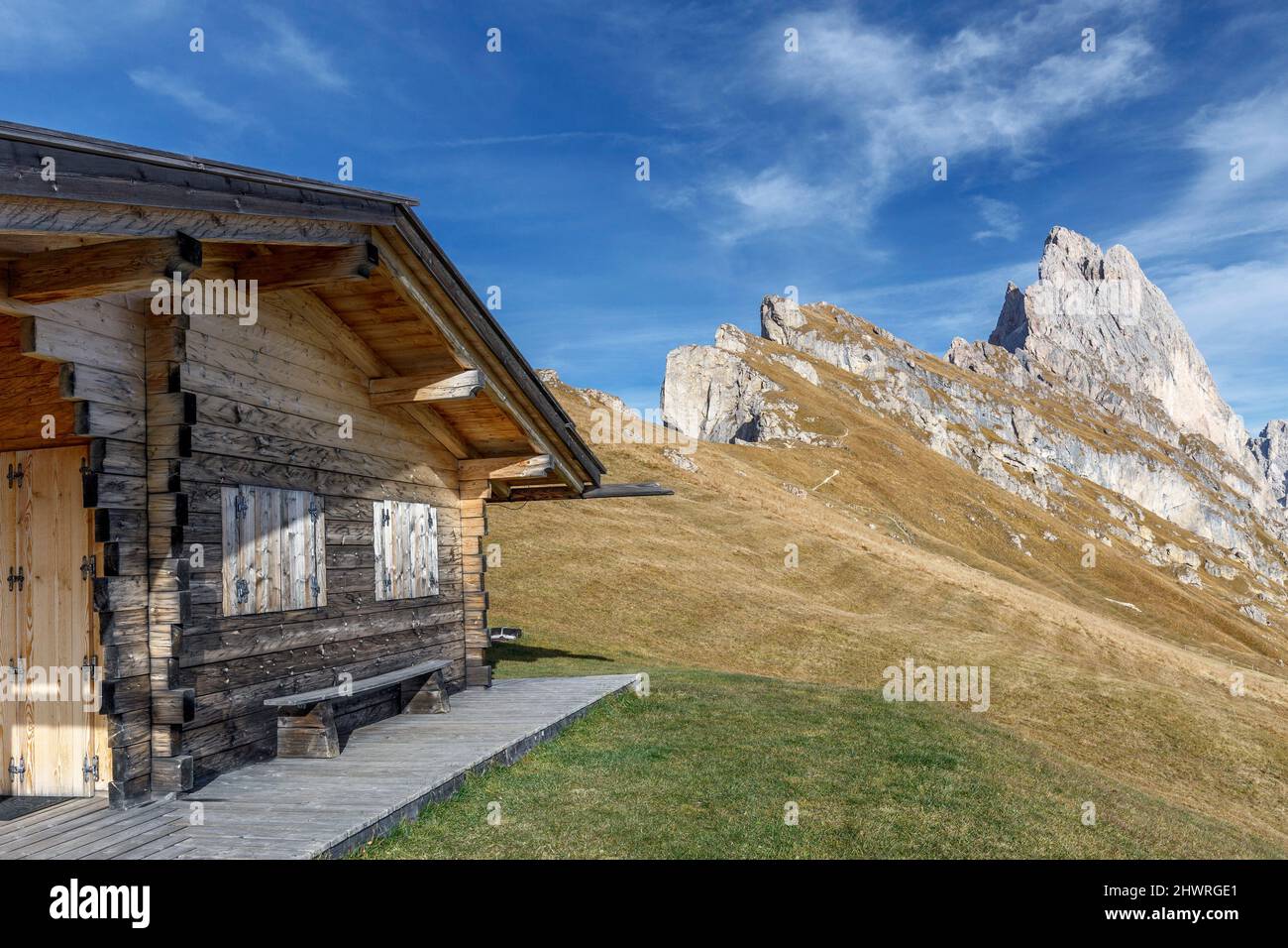 Wooden house and Grande Fermeda at Odle mountain group, Puez-Odle natural park, Dolomites, italian alps Stock Photo