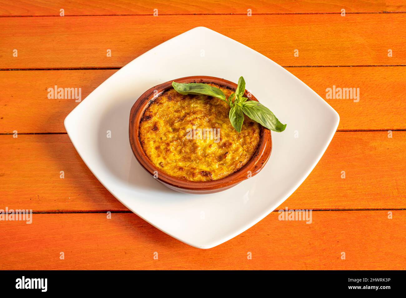 Pastel de choclo is a South American dish prepared with a baked paste of tender corn kernels and, depending on where it is prepared, it is sweet or sa Stock Photo