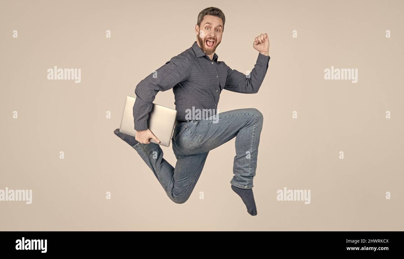 entrepreneur running and hurrying. agile business. network administrator hold computer. Stock Photo