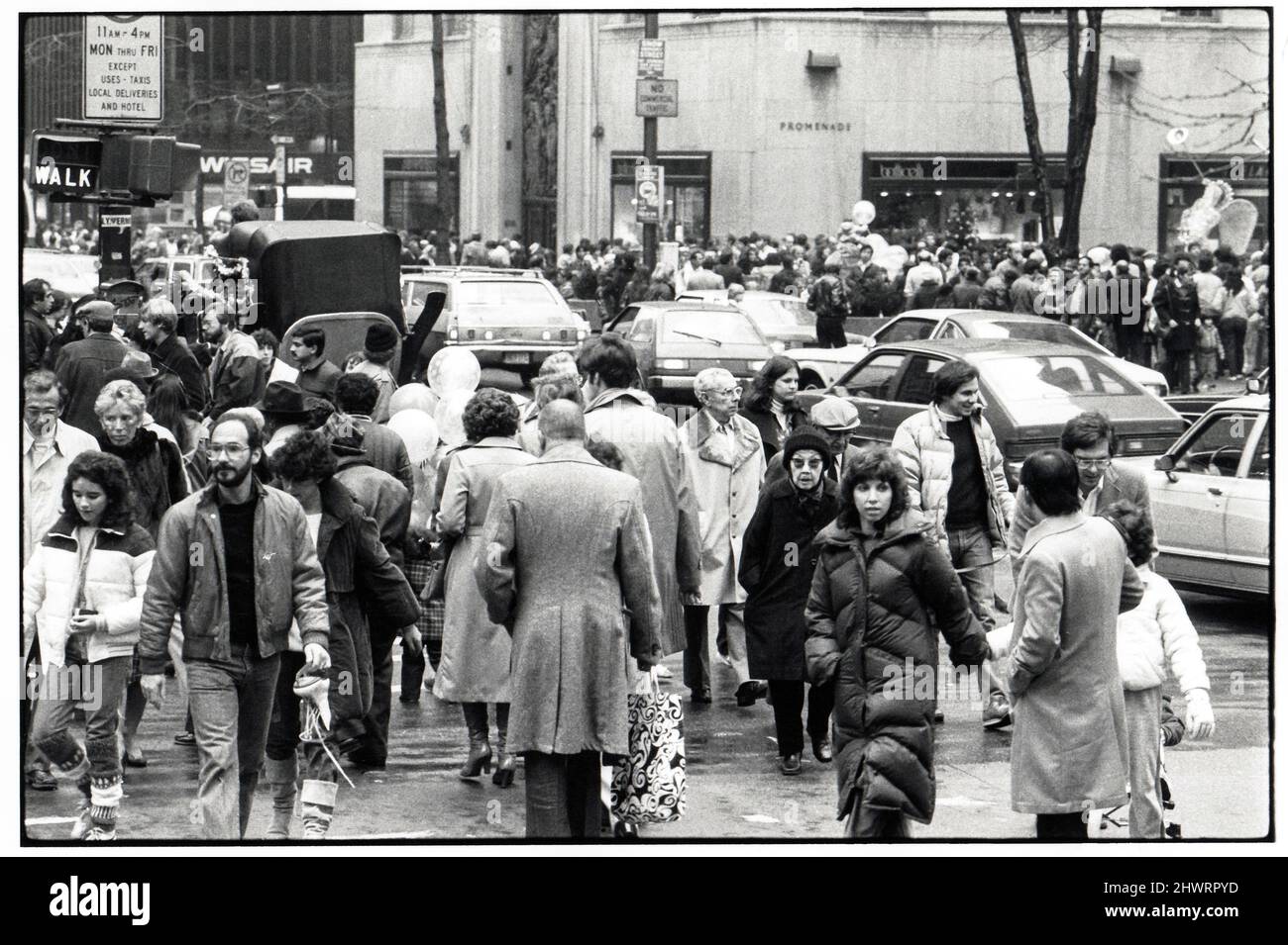 A very crowded Christmas season street scene in Manhattan on Fifth Avenue just off Rockefeller Center. Circa 1975. Stock Photo