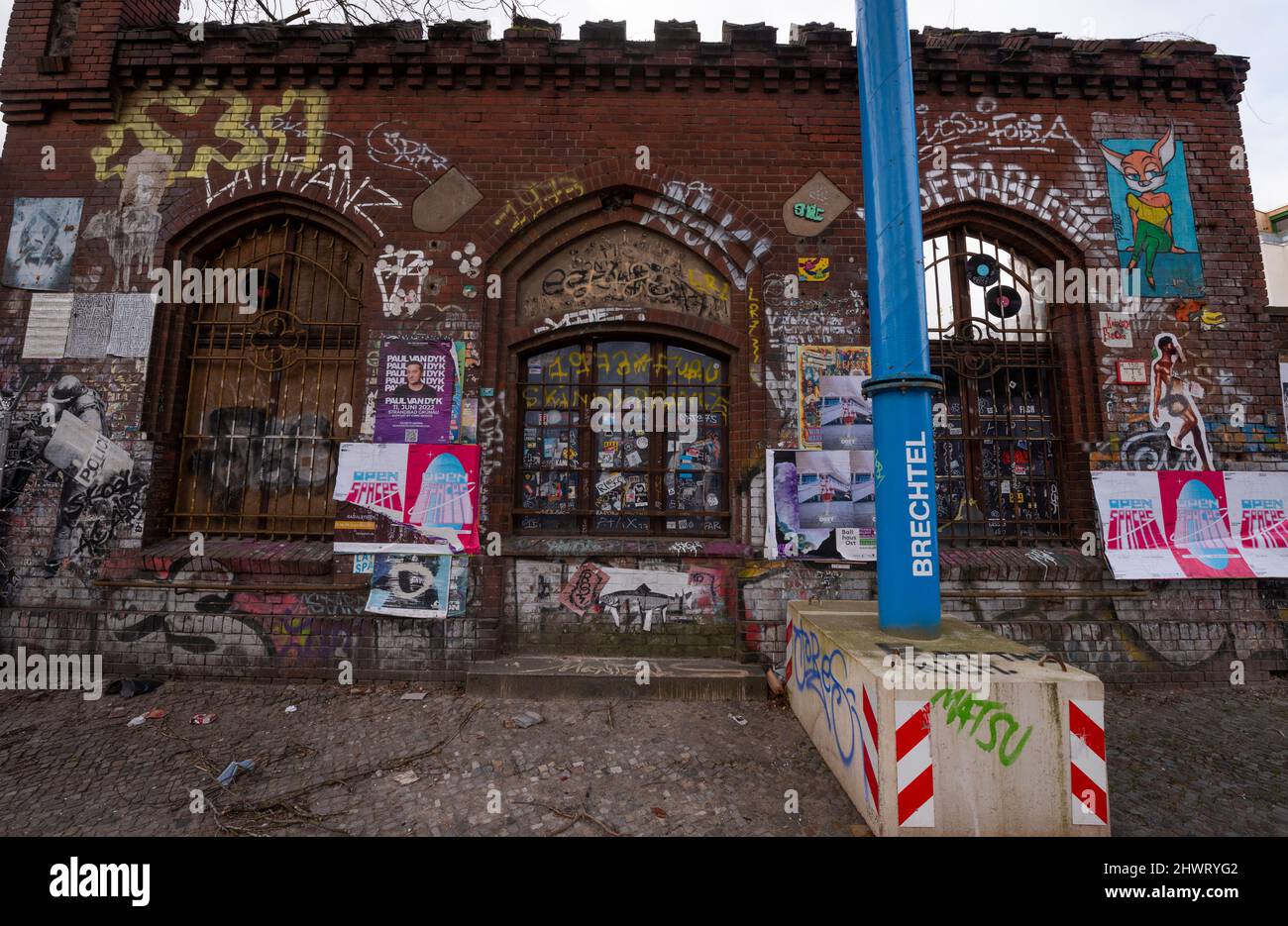Postering and graffiti on a wall in the Kreuzberg section of Berlin, Germany. Stock Photo