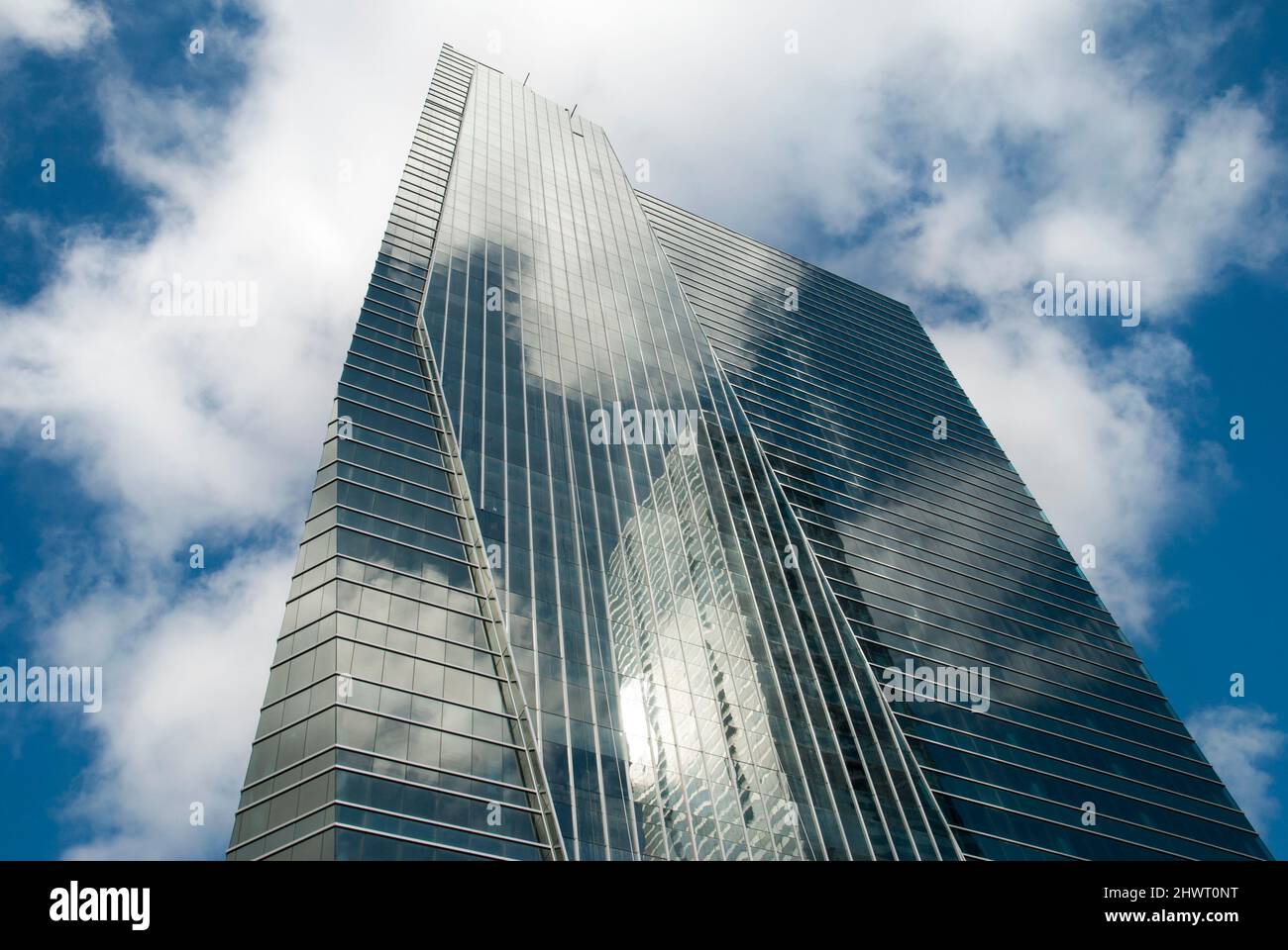 The abstract view of glass covered skyscraper with a reflection in ...