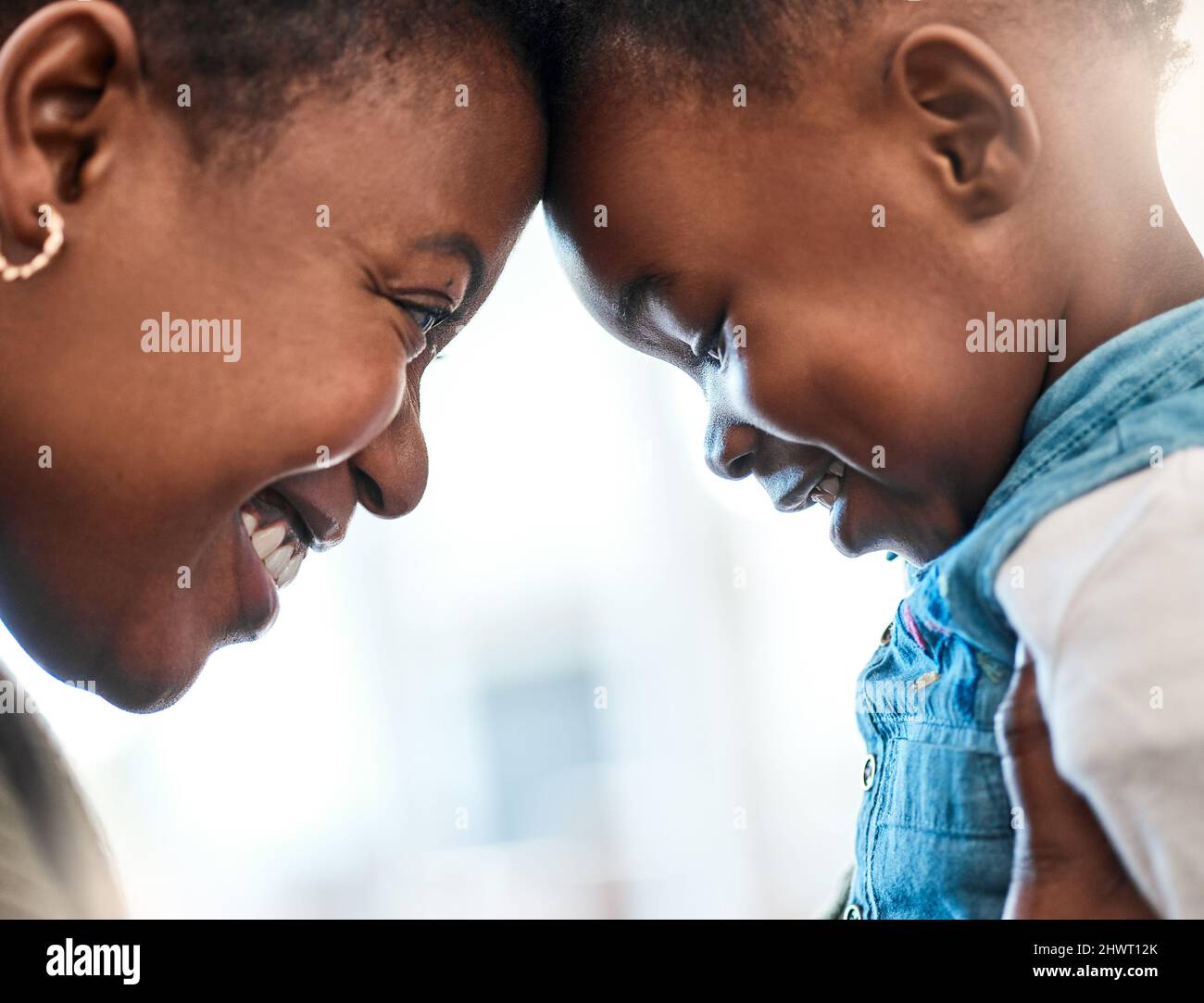 Mommas little sugar plum. Shot of an adorable little girl spending quality time with her mother at home. Stock Photo