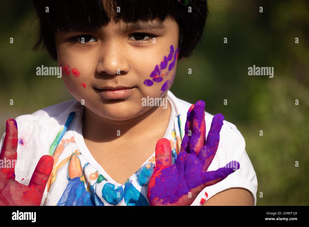 Colorful Holi Theme - Portrait Of Cute Indian Kid Painted In Holi Color Powder Called Rang Gulal Abeer Or Abir Stock Photo