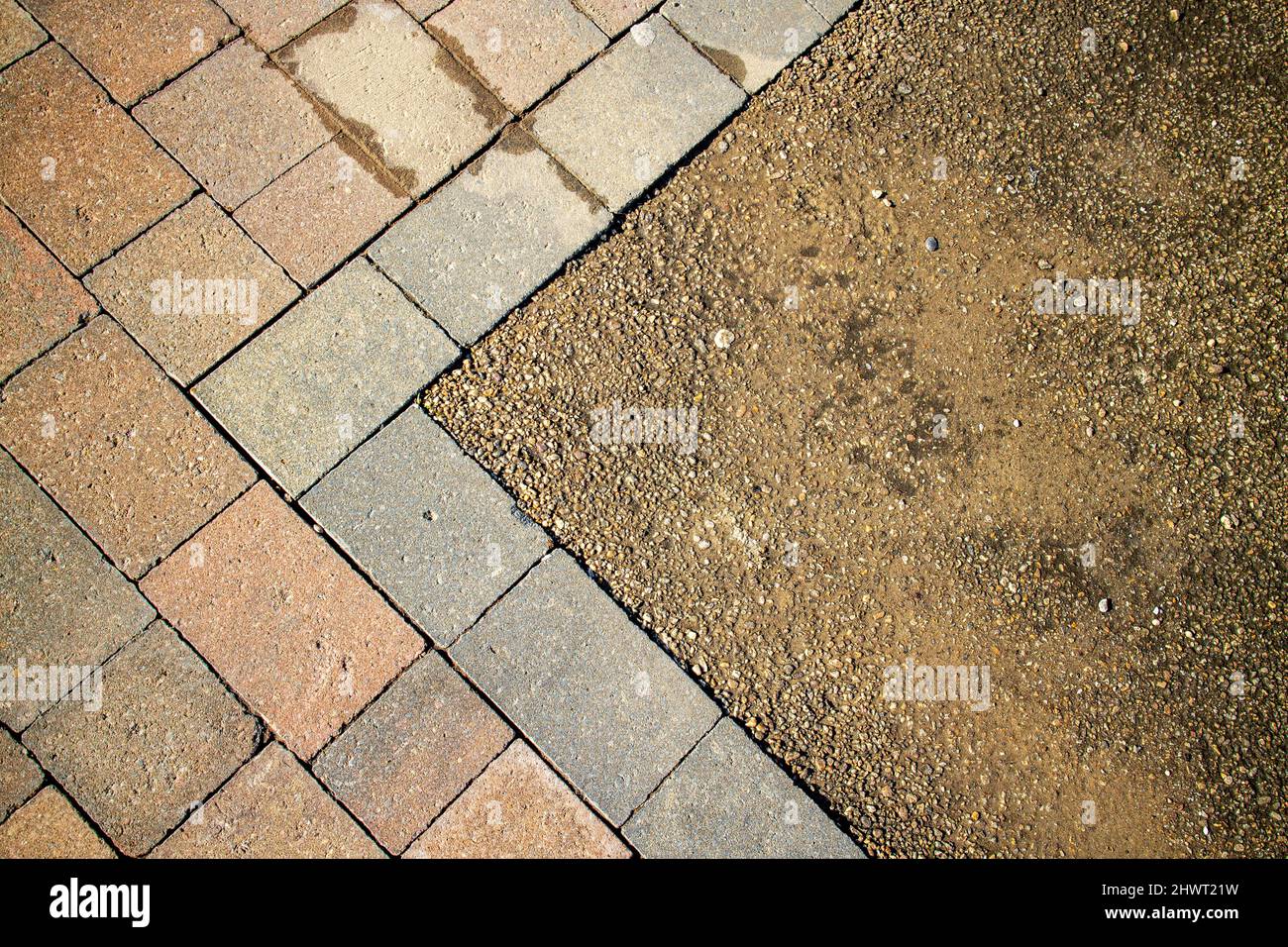 Epsom Surrey UK, March 07 2022, Block Paving Sidewalk With Gravel Close Up Looking Down With No People Stock Photo