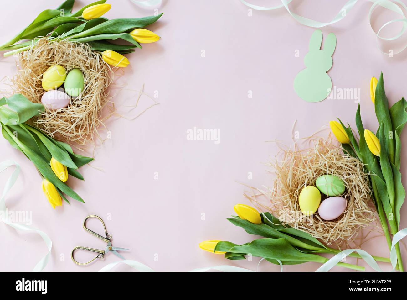 Stylish background with colorful easter eggs isolated on pastel pink ...