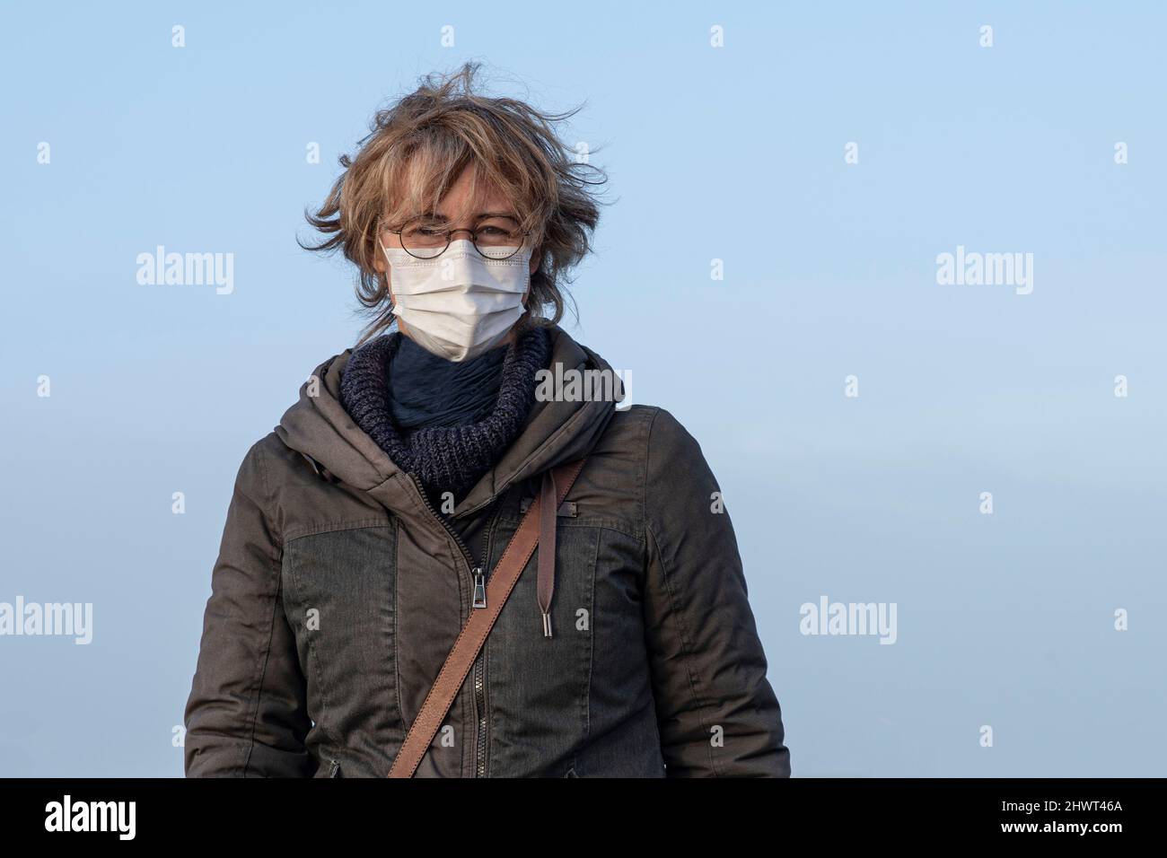 Senior woman wearing face mask hi-res stock photography and images - Alamy