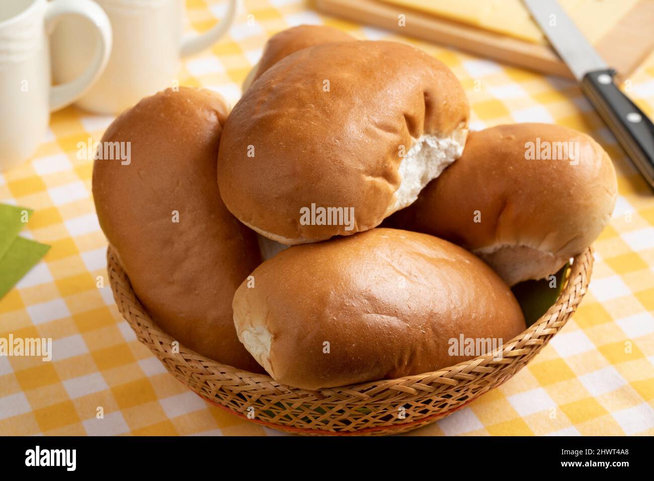 Traditional fresh Dutch white soft buns in a basket close up Stock Photo