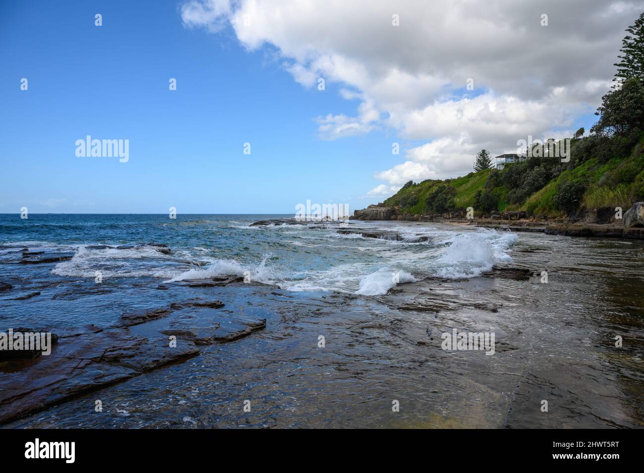 waves breaking on rocks in Australia Stock Photo