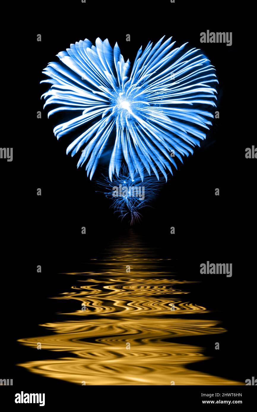 Blue and yellow firework in the shape of a heart,  help and love for Ukraine concept Stock Photo