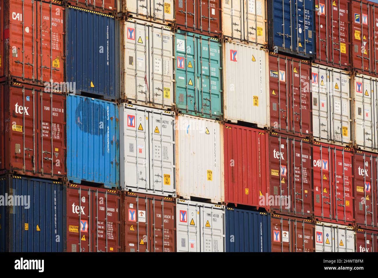 Seattle, WA, USA March 06, 2022; Stack of arranged intermodal shipping containers from