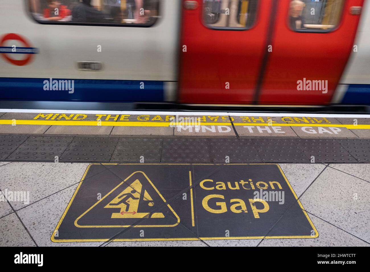 Mind the gap tube platform warning sign on a London Underground station  platform on 5th March 2022 in London, United Kingdom. Mind the gap is an  audible or visual warning phrase issued
