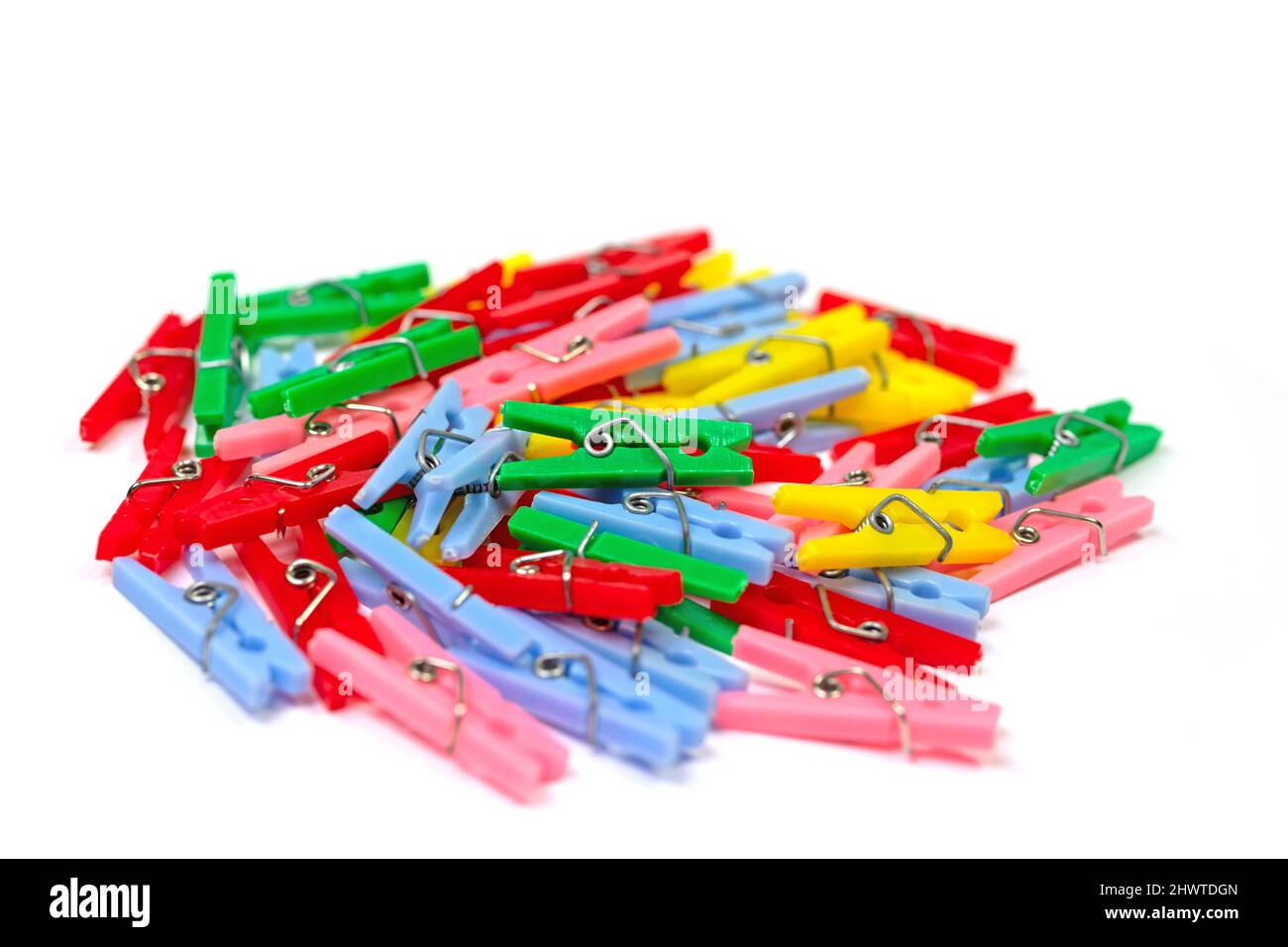 Colorful clothespins against white background Stock Photo