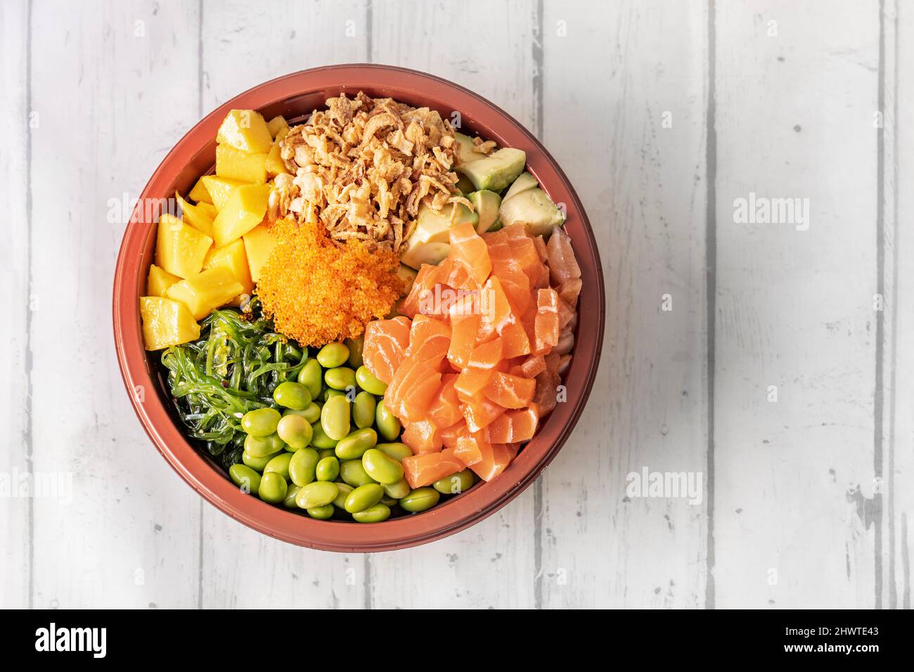 Premium Photo  Japanese poki with sashimi salmon avocado udon wakame  seaweed tuna on the old rusty wood table