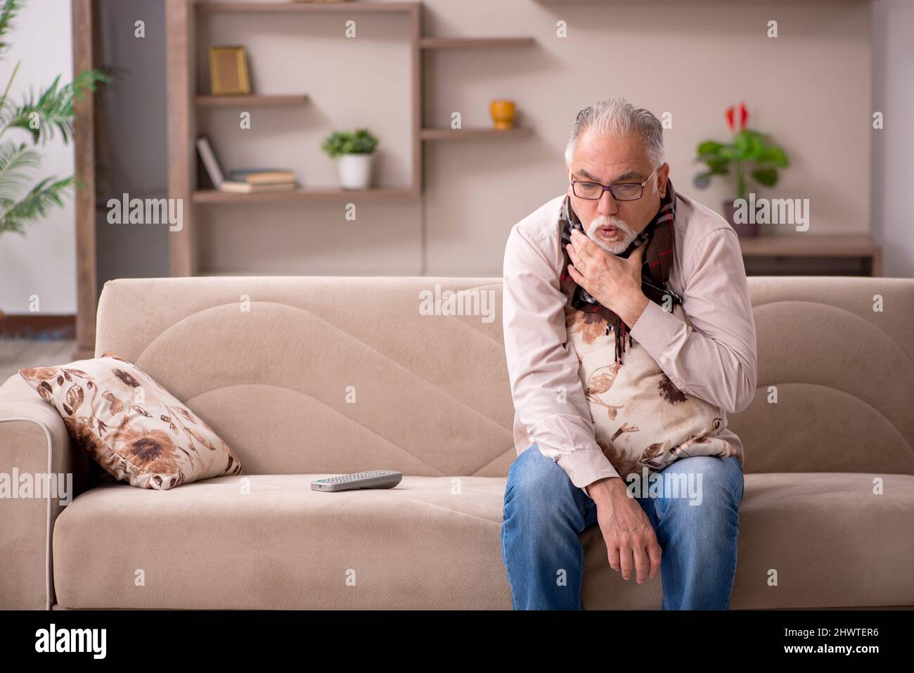 Sick old man coughing sitting hi-res stock photography and images - Alamy