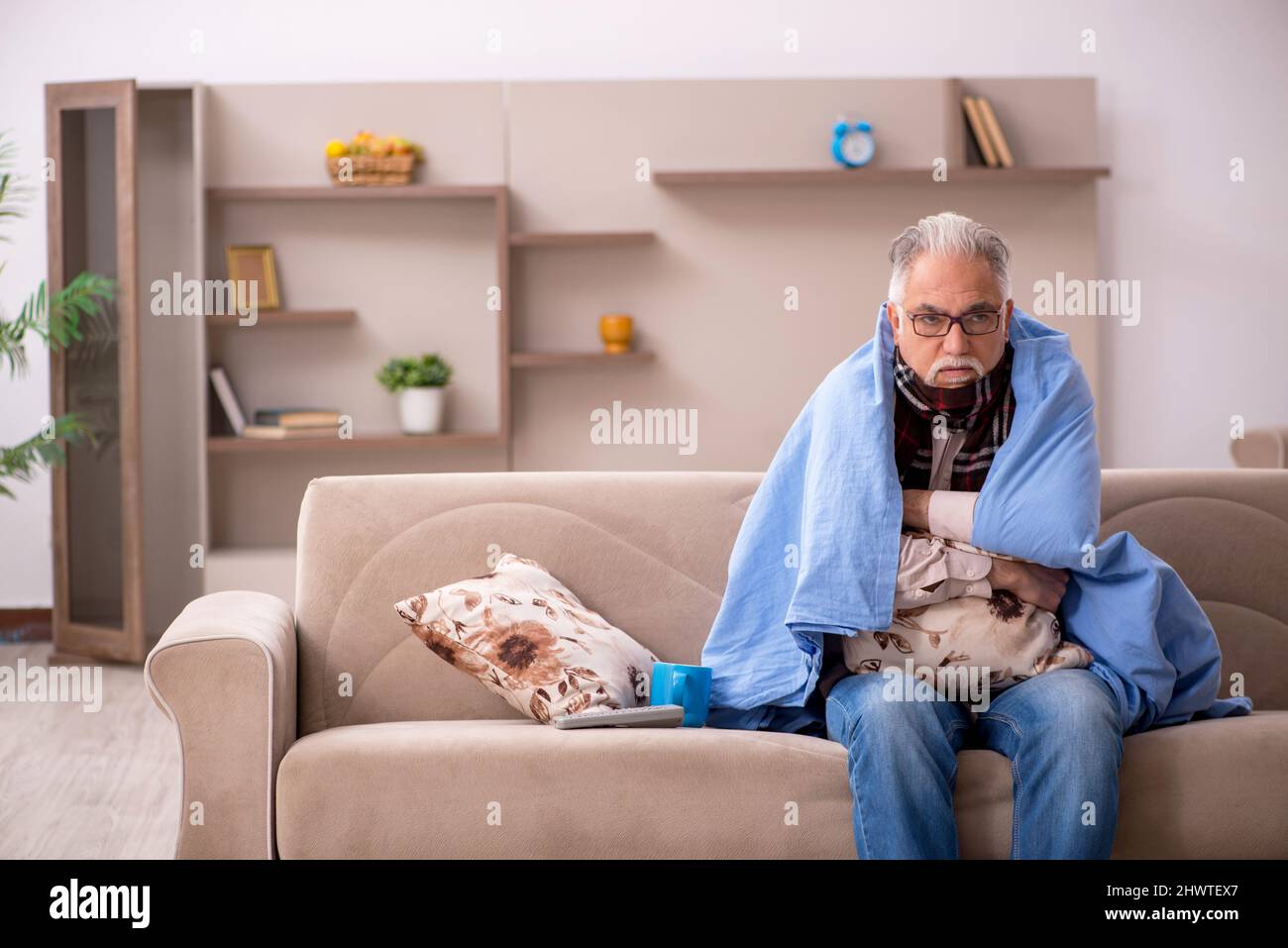 Sick old man coughing sitting hi-res stock photography and images - Alamy