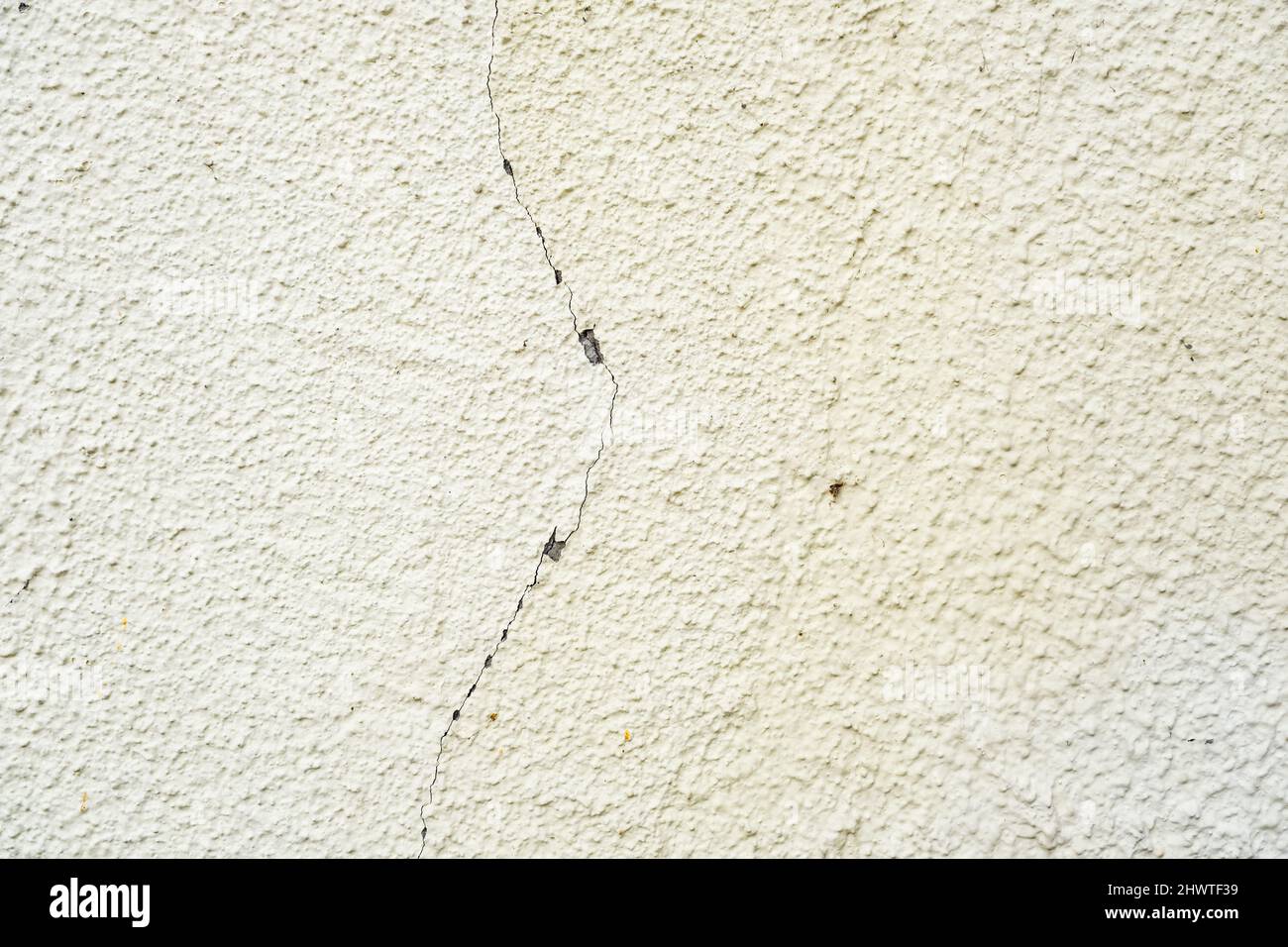 surface of concrete gray wall  in cracks Stock Photo