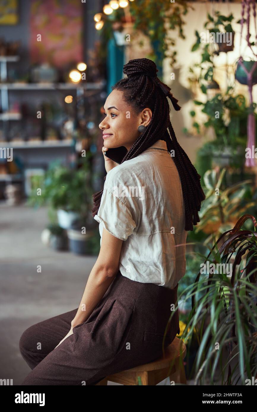 African woman sitting alone side view hi-res stock photography and ...