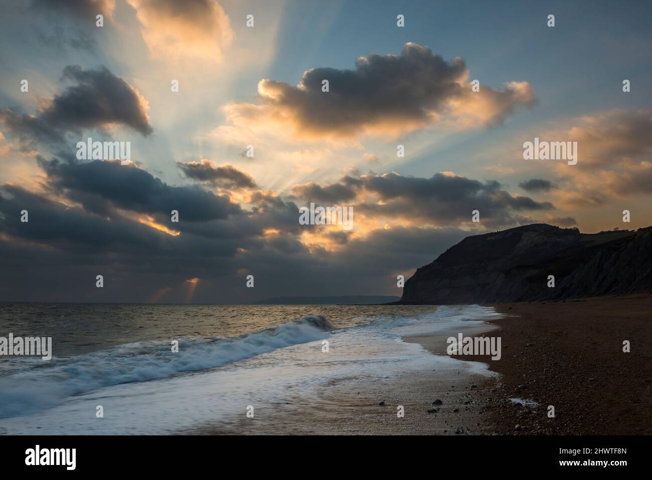 Seatown, Dorset, UK. 7th March 2022. UK Weather. A sunburst above the