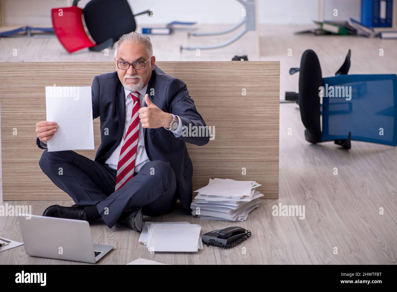 Old businessman employee working overtime at workplace Stock Photo - Alamy